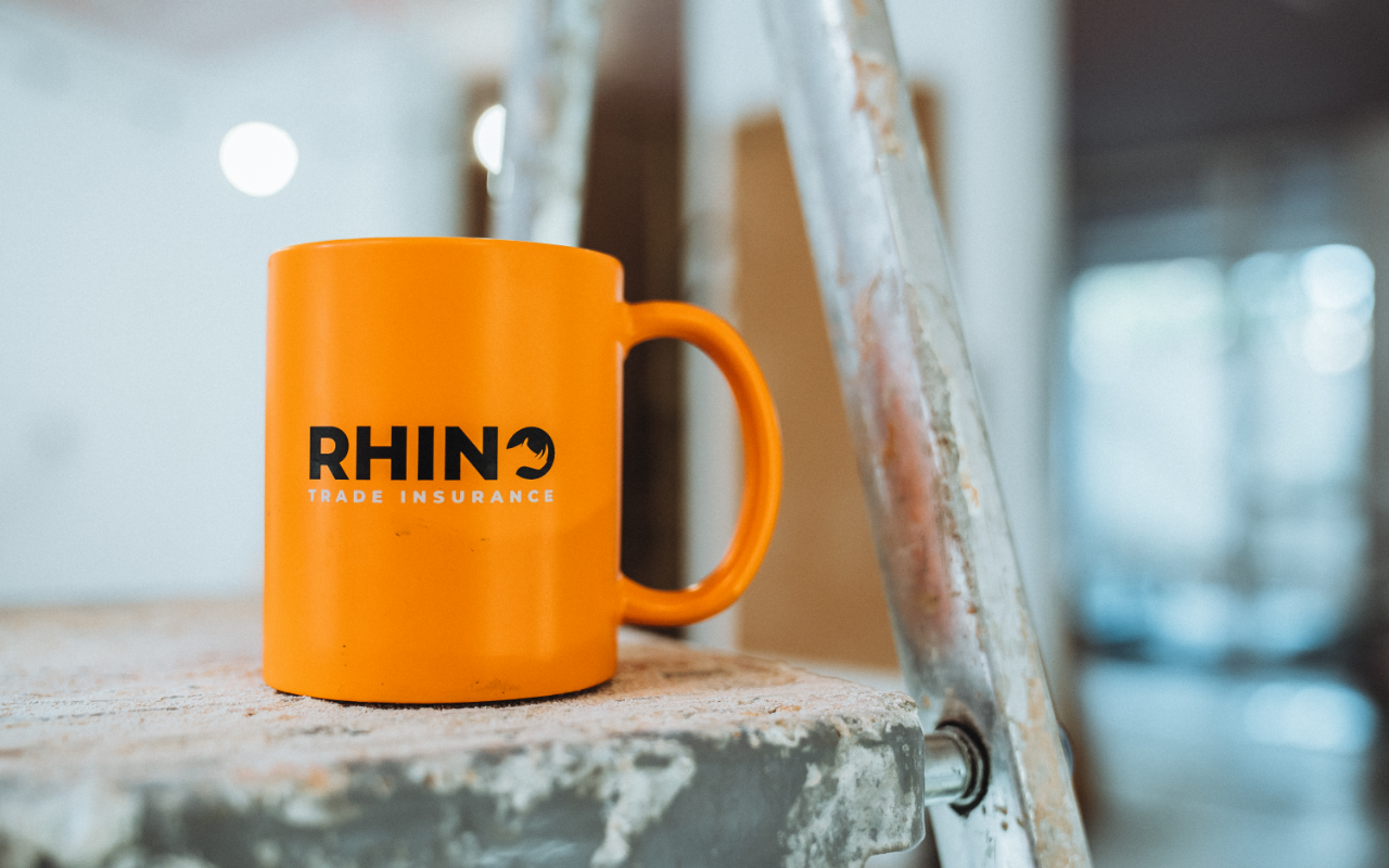rhino trade insurance mug on ladder