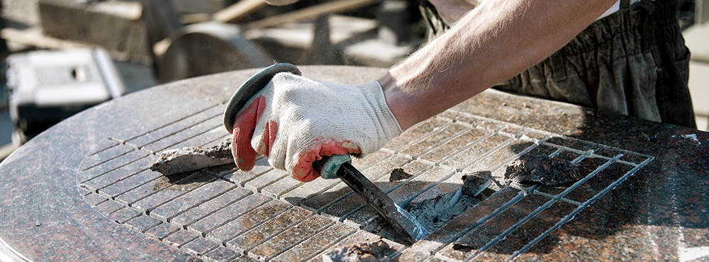 Man doing stone masonry work