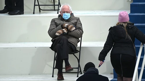 Man sitting on chair with mask on